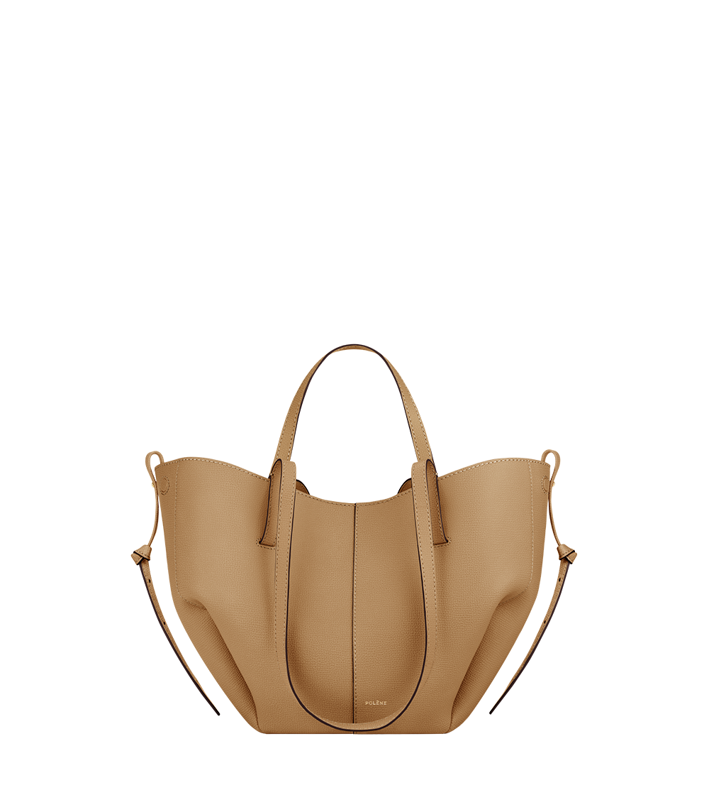 https://cdn.shopify.com/s/files/1/1005/6587/7067/files/packshot-front_cyme-mini-tan-gold-grain.png?v=1775509138